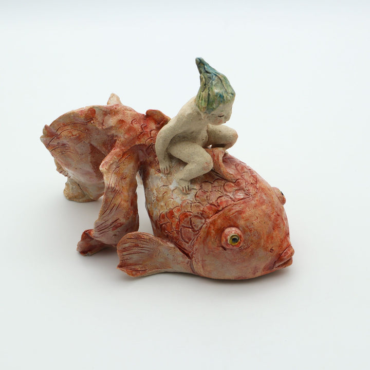 金魚にのる