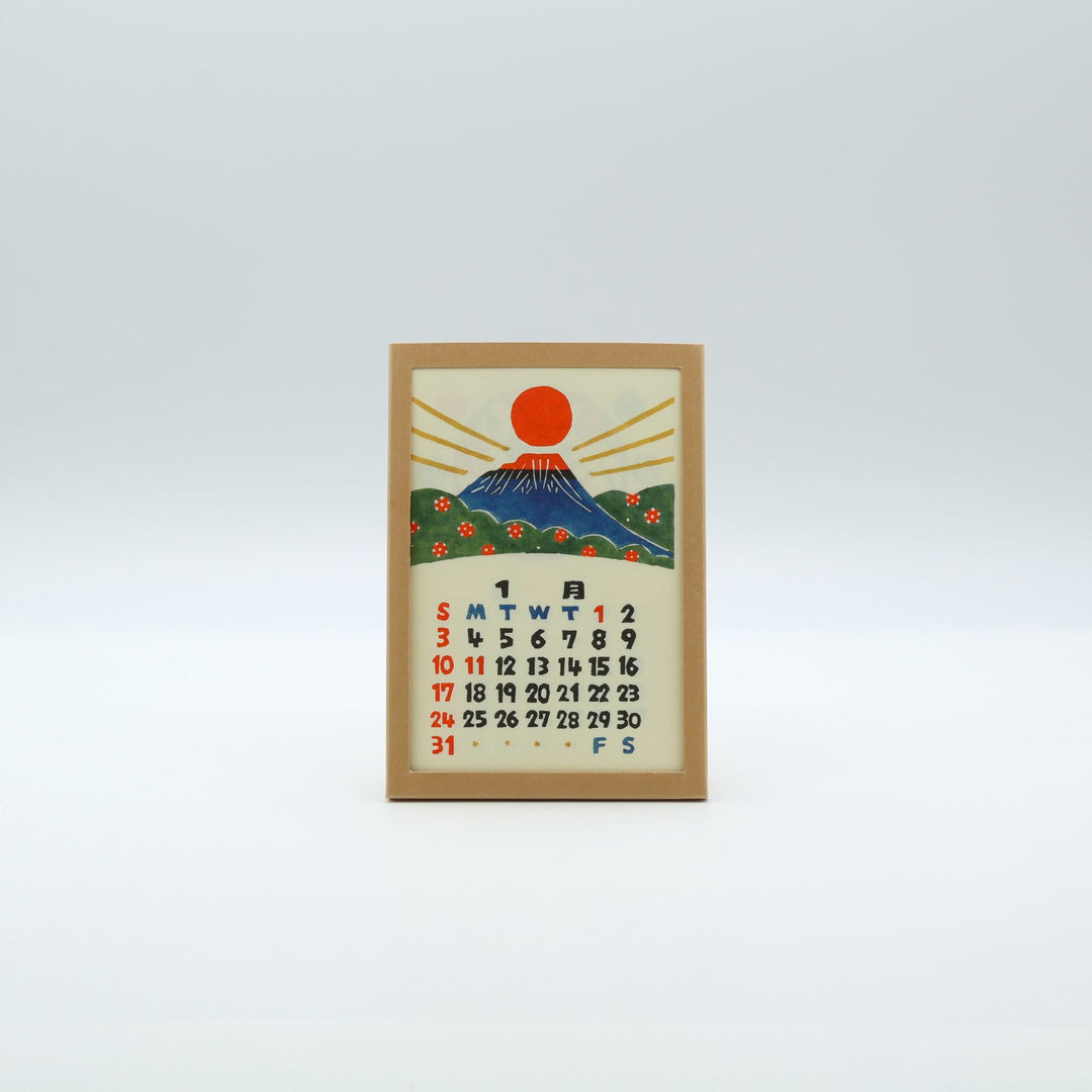 型染工・小田中耕一氏による2027年の卓上カレンダー。日本の行事と四季折々の型染絵のはがきサイズ月めくりカードとフレーム付き。
